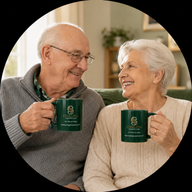 Companionship Care at Home | Starling Homecare Elderly couple smiling at home while holding Starling Homecare mugs