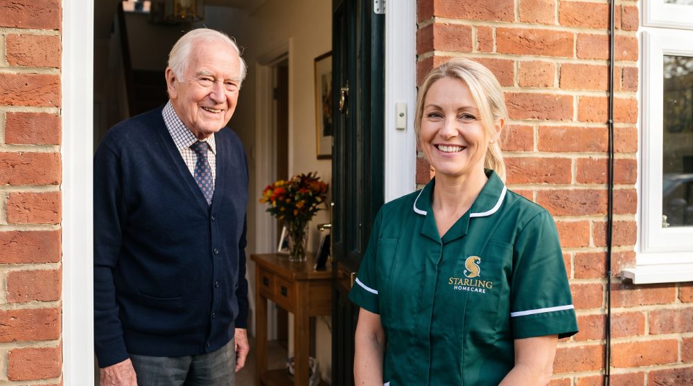 Attendance Allowance and other benefits: carer arriving at the door, Starling Homecare Hertfordshire A Starling Homecare carer welcomed at the front door by an older man in Hertfordshire, the kind of regular visit Attendance Allowance and other benefits can help to fund