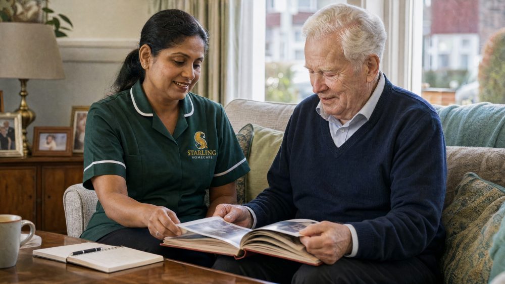 Memory Assessment in St Albans: A Guide for Families Carer in a bottle green uniform looking through a photo album with an older man before his memory assessment in St Albans